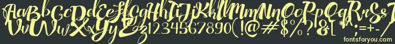 AdefebiaFreeFont Font – Yellow Fonts on Black Background