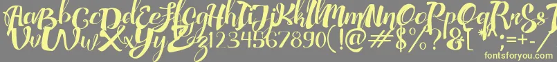 AdefebiaFreeFont Font – Yellow Fonts on Gray Background