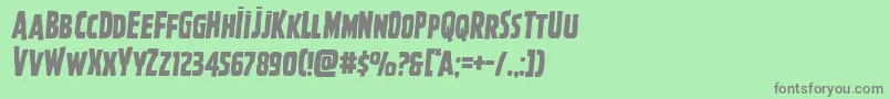 フォントGhoulishintentsemital – 緑の背景に灰色の文字