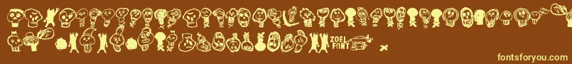 PaakallojenHyokkays-fontti – keltaiset fontit ruskealla taustalla