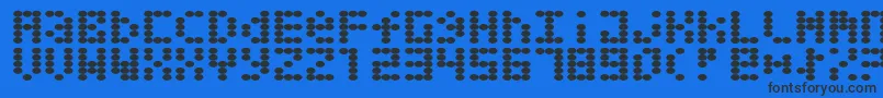 Greaseballs Font – Black Fonts on Blue Background