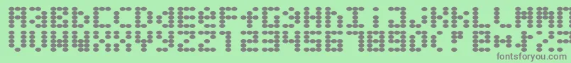 Greaseballs Font – Gray Fonts on Green Background