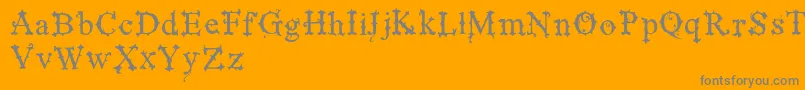 VtksBlackLabelNormal-fontti – harmaat kirjasimet oranssilla taustalla