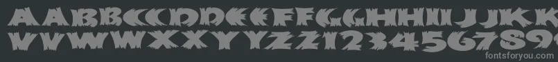 Klitschkotiqua-fontti – harmaat kirjasimet mustalla taustalla