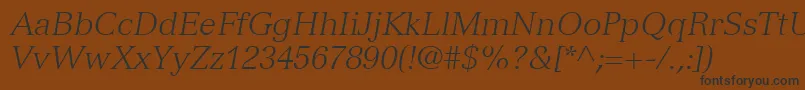 VersaillesLt46LightItalicフォントについての詳細 フォントVersaillesLt46LightItalic – 黒い文字が茶色の背景にあります