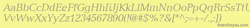 VersaillesLt46LightItalic-fontti – harmaat kirjasimet keltaisella taustalla