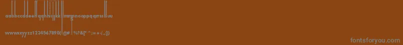 Fonte ThiamineRegular – fontes cinzas em um fundo marrom