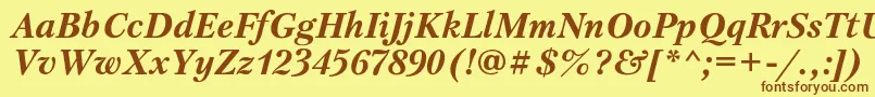 フォントPetersburgcBolditalic – 茶色の文字が黄色の背景にあります。