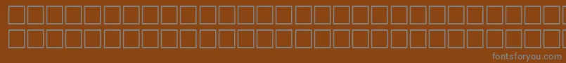 TrkQuraan Font – Gray Fonts on Brown Background