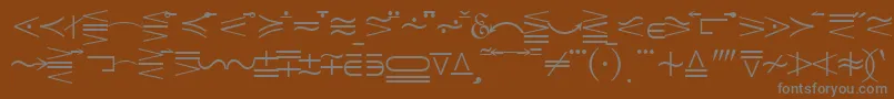 Quantapionessk-fontti – harmaat kirjasimet ruskealla taustalla