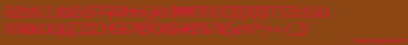 フォントWhatsMyAgeAgainTtf – 赤い文字が茶色の背景にあります。