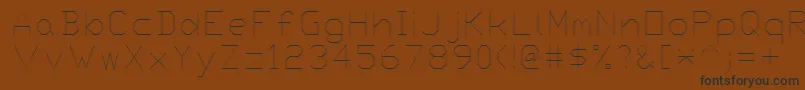 Proxy7-Schriftart – Schwarze Schriften auf braunem Hintergrund