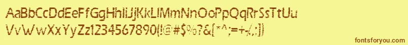 フォントScrab – 茶色の文字が黄色の背景にあります。