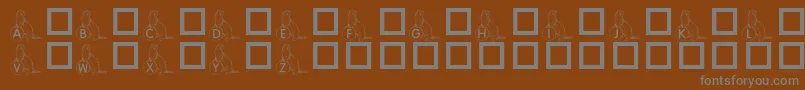 KrAFerretForAngel Font – Gray Fonts on Brown Background