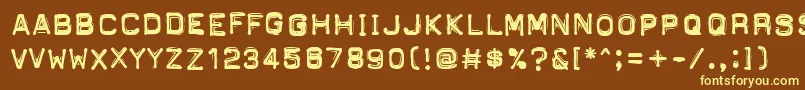 PftapeomaticHighPressure-fontti – keltaiset fontit ruskealla taustalla