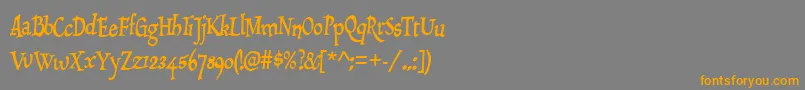 フォントDraculon – オレンジの文字は灰色の背景にあります。