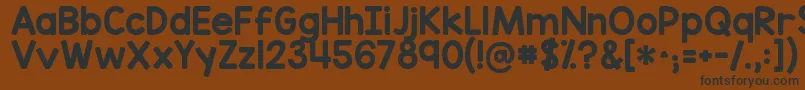 フォントKgredhands – 黒い文字が茶色の背景にあります