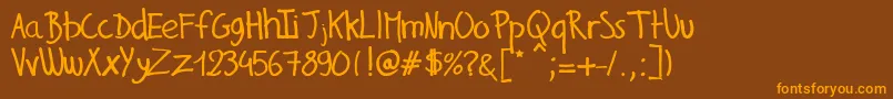 GillesHandwriting Font – Orange Fonts on Brown Background