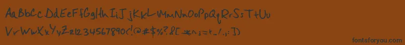 フォントMisterspicydos – 黒い文字が茶色の背景にあります