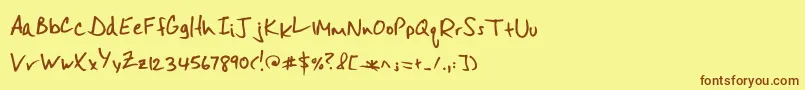 フォントMisterspicydos – 茶色の文字が黄色の背景にあります。