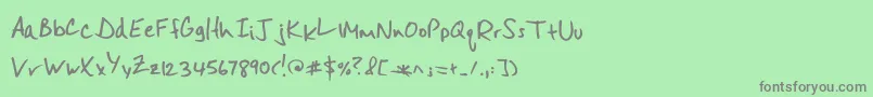 フォントMisterspicydos – 緑の背景に灰色の文字