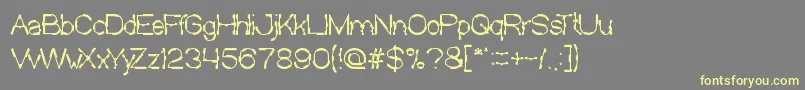 MickJagged Font – Yellow Fonts on Gray Background