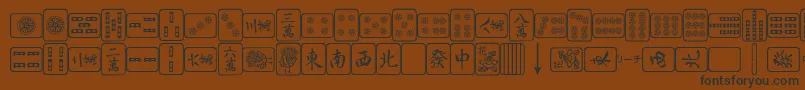 フォントMa – 黒い文字が茶色の背景にあります