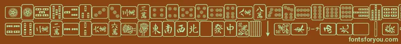 フォントMa – 緑色の文字が茶色の背景にあります。