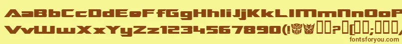 フォントTranreb – 茶色の文字が黄色の背景にあります。