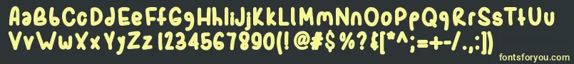 フォントSporkbold – 黒い背景に黄色の文字