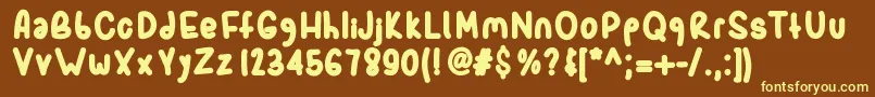 Sporkbold-Schriftart – Gelbe Schriften auf braunem Hintergrund