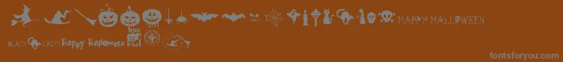 FreakyHalloween-Schriftart – Graue Schriften auf braunem Hintergrund