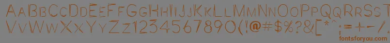Jaggpnt-Schriftart – Braune Schriften auf grauem Hintergrund