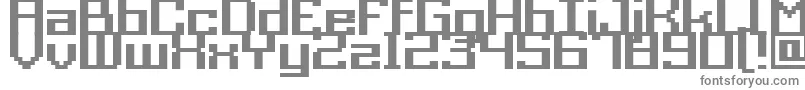 Acme9RegularBold-fontti – harmaat kirjasimet valkoisella taustalla