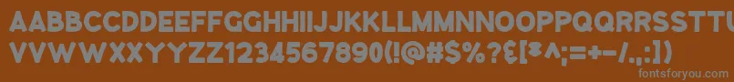 GooseberryJuice-fontti – harmaat kirjasimet ruskealla taustalla