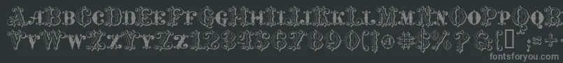 MavericksLuckySpades-fontti – harmaat kirjasimet mustalla taustalla
