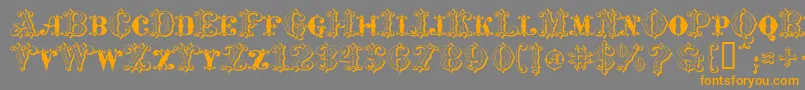 フォントMavericksLuckySpades – オレンジの文字は灰色の背景にあります。