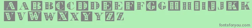 Tolecaps Font – Gray Fonts on Green Background