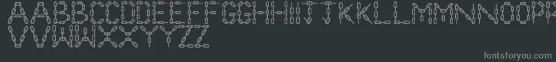 Czcionka ChainLetters – szare czcionki na czarnym tle