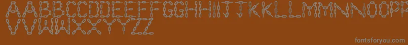 ChainLetters Font – Gray Fonts on Brown Background