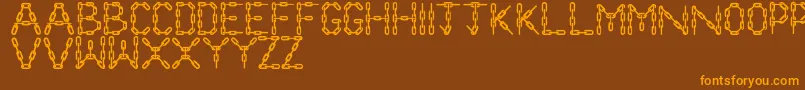 ChainLetters-fontti – oranssit fontit ruskealla taustalla