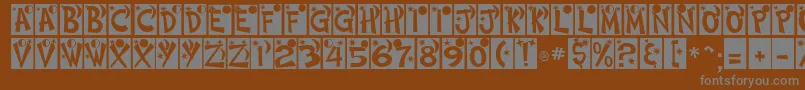 HimmelNormalDb-fontti – harmaat kirjasimet ruskealla taustalla