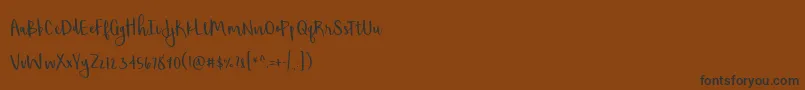Czcionka BmdShorthalt – czarne czcionki na brązowym tle
