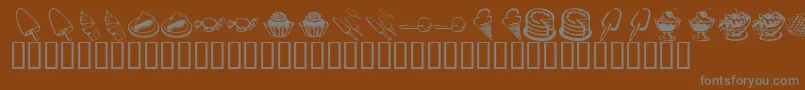 KrSweetTooth-Schriftart – Graue Schriften auf braunem Hintergrund