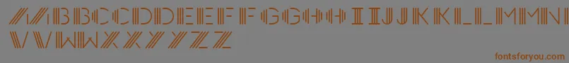 フォントPhotocab – 茶色の文字が灰色の背景にあります。