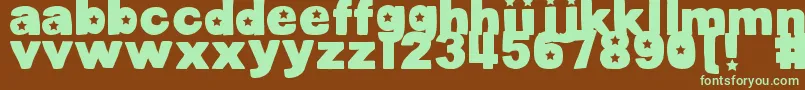 フォントDjbCutoutsStars – 緑色の文字が茶色の背景にあります。