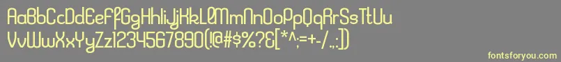 KleptocracyltRegular Font – Yellow Fonts on Gray Background