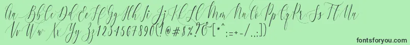 Czcionka CharlotteCalligraphyR1 – czarne czcionki na zielonym tle