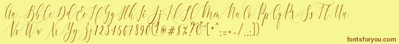 Fonte CharlotteCalligraphyR1 – fontes marrons em um fundo amarelo