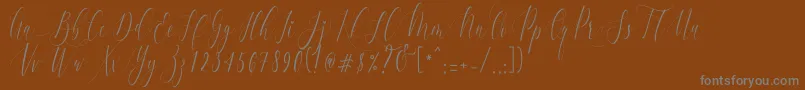 Шрифт CharlotteCalligraphyR1 – серые шрифты на коричневом фоне